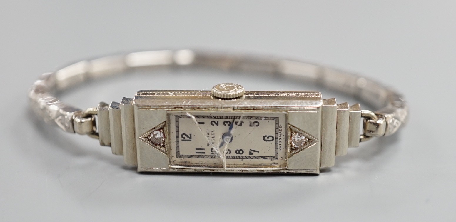 A lady's white metal and two stone diamond set C.R. Bucherer's Rolex Princess manual wind cocktail watch, case diameter 12mm.
